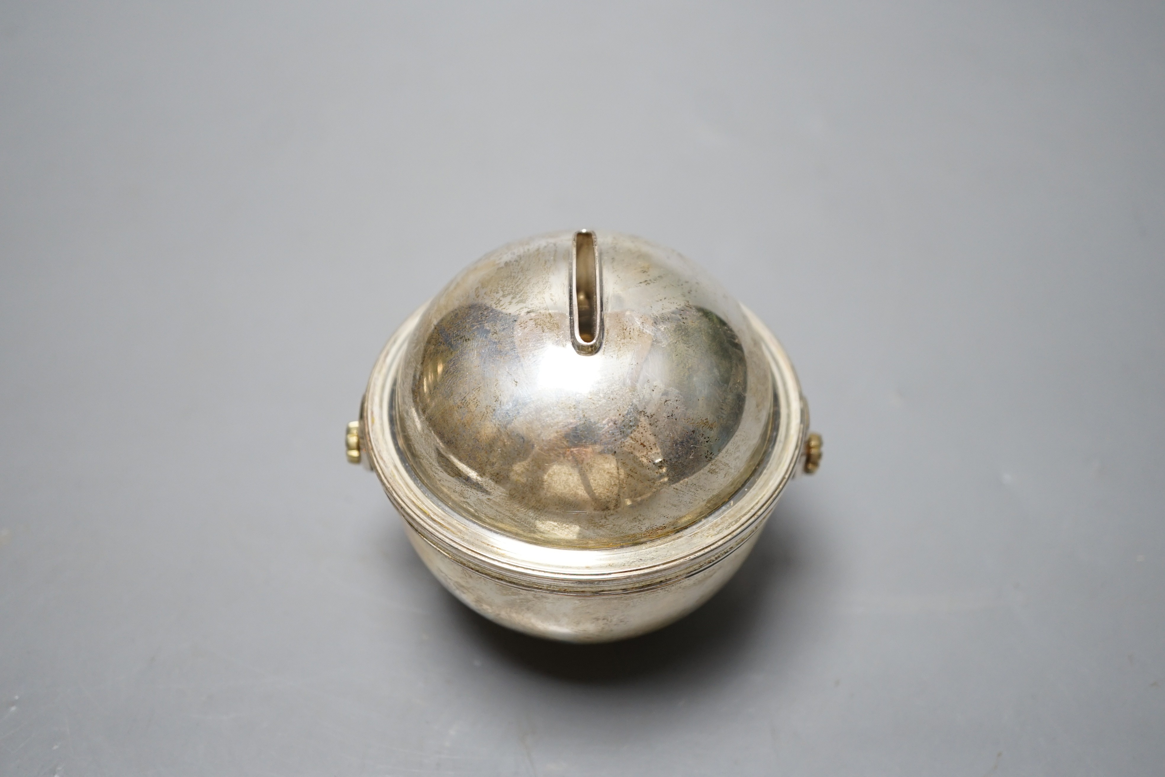 A modern Italian silver globular money box, retailed by Bulgari, London, import marks, height 91mm, gross 7.3 oz.